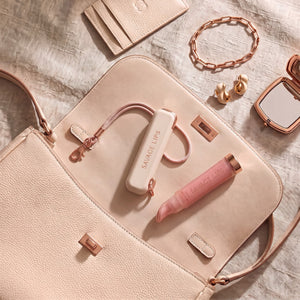 Lip Pod clipped to a bag strap